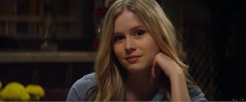 Movie still from “The Kings of Summer” (2013), directed by Jordan Vogt-Roberts – A beautiful young lady sitting in front of a mirror; Close Up shot, Over the shoulder angle