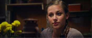 Movie still from “The Kings of Summer” (2013), directed by Jordan Vogt-Roberts – A person sitting in a room; Close Up shot, Over the shoulder angle