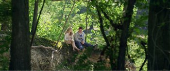 Movie still from “The Kings of Summer” (2013), directed by Jordan Vogt-Roberts – A man and a woman sitting on top of a tree; Wide shot, High angle