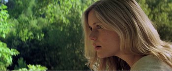 Movie still from “The Kings of Summer” (2013), directed by Jordan Vogt-Roberts – A person with long blonde hair; Close Up shot, Low angle