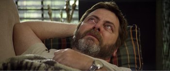 Movie still from “The Kings of Summer” (2013), directed by Jordan Vogt-Roberts – A person sitting on a couch; Close Up shot, High angle