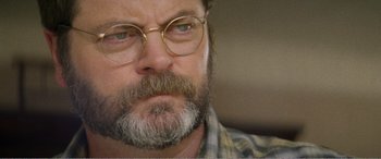 Movie still from “The Kings of Summer” (2013), directed by Jordan Vogt-Roberts – A person with a beard wearing glasses; Close Up shot, Over the shoulder angle