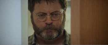 Movie still from “The Kings of Summer” (2013), directed by Jordan Vogt-Roberts – A person with a beard wearing glasses; Close Up shot, Over the shoulder angle