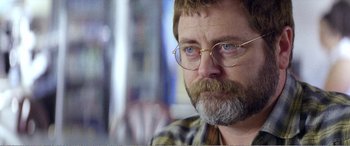 Movie still from “The Kings of Summer” (2013), directed by Jordan Vogt-Roberts – A person with a beard wearing glasses; Close Up shot, Over the shoulder angle