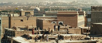 Movie still from “The Kite Runner” (2007), directed by Marc Forster – A group of people standing on top of a building; Extreme Wide shot, High angle