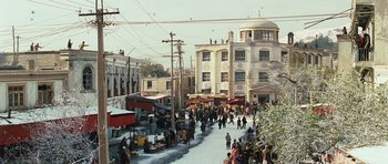 Movie still from “The Kite Runner” (2007), directed by Marc Forster – A street with many people walking on the sidewalk; Extreme Wide shot, High angle