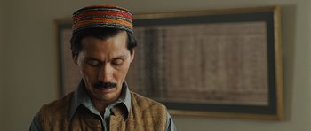 Movie still from “The Kite Runner” (2007), directed by Marc Forster – A person wearing a hat; Close Up shot, High angle