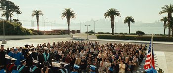 Movie still from “The Kite Runner” (2007), directed by Marc Forster – A crowd of people sitting in front of a body of water; Extreme Wide shot, High angle