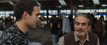 Movie still from “The Kite Runner” (2007), directed by Marc Forster – A man and a woman talking to each other; Medium shot, Over the shoulder angle