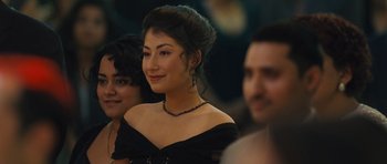 Movie still from “The Kite Runner” (2007), directed by Marc Forster – A beautiful young lady wearing a black dress; Close Up shot, Over the shoulder angle