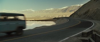 Movie still from “The Kite Runner” (2007), directed by Marc Forster – A road that is going down the side of the road; Extreme Wide shot, High angle