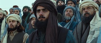 Movie still from “The Kite Runner” (2007), directed by Marc Forster – A group of men standing next to each other; Close Up shot, Low angle