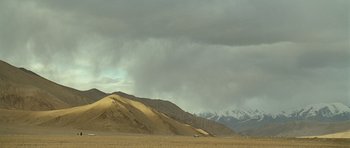 Movie still from “The Kite Runner” (2007), directed by Marc Forster – A view of a desert with mountains in the background; Extreme Wide shot, Low angle