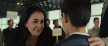 Movie still from “The Kite Runner” (2007), directed by Marc Forster – A woman is smiling at a man in a suit; Close Up shot, Over the shoulder angle