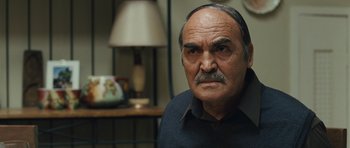 Movie still from “The Kite Runner” (2007), directed by Marc Forster – An old man with a mustache and a mustache on his head; Close Up shot, Low angle