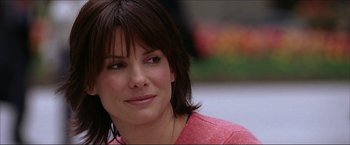 Movie still from “The Lake House” (2006), directed by Alejandro Agresti – A person wearing a pink shirt; Close Up shot, Over the shoulder angle