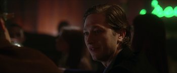 Movie still from “The Lake House” (2006), directed by Alejandro Agresti – A person sitting at a table; Close Up shot, Over the shoulder angle