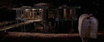 Movie still from “The Lake House” (2006), directed by Alejandro Agresti – An abandoned house in the middle of a field at night; Extreme Wide shot, High angle