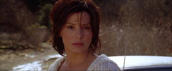 Movie still from “The Lake House” (2006), directed by Alejandro Agresti – A person wearing a sweater; Close Up shot, Over the shoulder angle