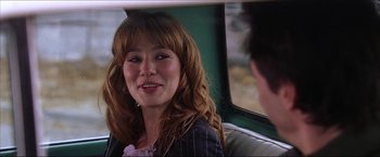 Movie still from “The Lake House” (2006), directed by Alejandro Agresti – A woman sitting in the back seat of a car; Close Up shot, Over the shoulder angle