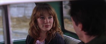 Movie still from “The Lake House” (2006), directed by Alejandro Agresti – A woman sitting in a car looking at the camera; Close Up shot, Over the shoulder angle