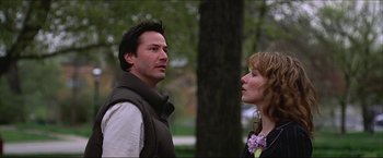 Movie still from “The Lake House” (2006), directed by Alejandro Agresti – A man and a woman standing next to each other in a park; Close Up shot, Over the shoulder angle