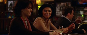 Movie still from “The Lake House” (2006), directed by Alejandro Agresti – Two women sitting at a table with a glass of white wine; Close Up shot, Over the shoulder angle