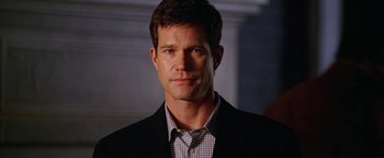 Movie still from “The Lake House” (2006), directed by Alejandro Agresti – A person wearing a suit and tie; Close Up shot, Over the shoulder angle