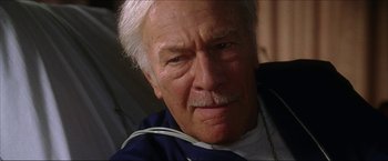 Movie still from “The Lake House” (2006), directed by Alejandro Agresti – An older man with white hair looking at the camera; Close Up shot, Low angle