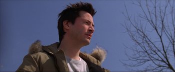 Movie still from “The Lake House” (2006), directed by Alejandro Agresti – A young man with a fur coat is looking up; Close Up shot, Low angle