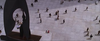 Movie still from “The Lake House” (2006), directed by Alejandro Agresti – A group of people walking on the sidewalk; Extreme Wide shot, Overhead angle