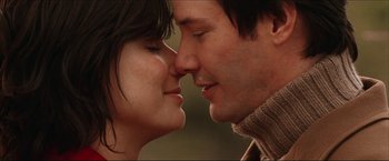 Movie still from “The Lake House” (2006), directed by Alejandro Agresti – A man and a woman are kissing each other; Close Up shot, Low angle
