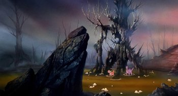 Movie still from “The Land Before Time” (1988), directed by Don Bluth – A painting of trees and rocks in the middle of a field; Wide shot, High angle