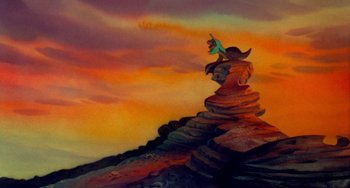 Movie still from “The Land Before Time” (1988), directed by Don Bluth – A painting of a person standing on top of a mountain; Extreme Wide shot, Low angle