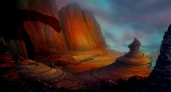 Movie still from “The Land Before Time” (1988), directed by Don Bluth – An artistic painting of a desert landscape with mountains in the background; Extreme Wide shot, Low angle