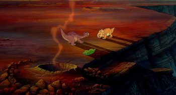 Movie still from “The Land Before Time” (1988), directed by Don Bluth – A painting of two dinosaurs in a field; Wide shot, High angle