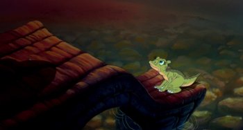 Movie still from “The Land Before Time” (1988), directed by Don Bluth – A painting of a frog sitting next to a large snake; Wide shot, High angle