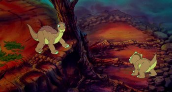 Movie still from “The Land Before Time” (1988), directed by Don Bluth – A painting of two dinosaurs in the middle of a forest; Wide shot, High angle