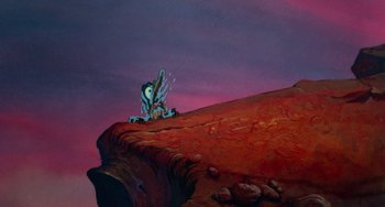 Movie still from “The Land Before Time” (1988), directed by Don Bluth – A painting of an animal on top of a cliff; Extreme Wide shot, Low angle