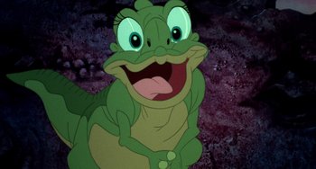 Movie still from “The Land Before Time” (1988), directed by Don Bluth – A frog with its mouth wide open; Close Up shot, High angle