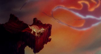 Movie still from “The Land Before Time” (1988), directed by Don Bluth – A painting of a dinosaur on a cliff; Extreme Wide shot, Overhead angle