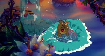 Movie still from “The Land Before Time” (1988), directed by Don Bluth – An animated scene of a bear and a dog in the water; Wide shot, High angle