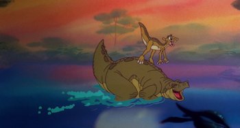 Movie still from “The Land Before Time” (1988), directed by Don Bluth – A painting of an animal riding an alligator in the water; Wide shot, Low angle