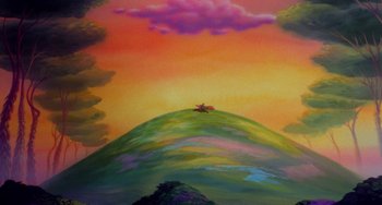 Movie still from “The Land Before Time” (1988), directed by Don Bluth – A painting of an animal on top of a hill; Extreme Wide shot, High angle