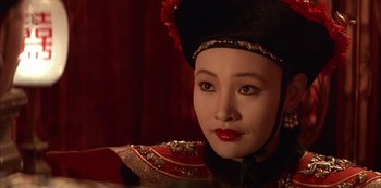 Movie still from “The Last Emperor” (1987), directed by Bernardo Bertolucci – A person wearing a hat; Close Up shot, High angle