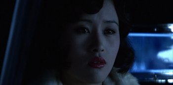 Movie still from “The Last Emperor” (1987), directed by Bernardo Bertolucci – A person wearing a red lipstick; Close Up shot, Low angle