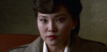 Movie still from “The Last Emperor” (1987), directed by Bernardo Bertolucci – A person wearing a jacket; Close Up shot, High angle