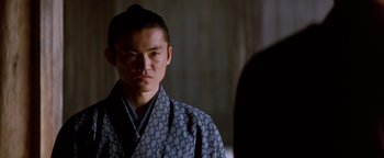 Movie still from “The Last Samurai” (2003), directed by Edward Zwick – A young man in a kimono looking at the camera; Close Up shot, Over the shoulder angle