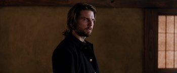 Movie still from “The Last Samurai” (2003), directed by Edward Zwick – A person with long hair wearing a jacket; Close Up shot, Over the shoulder angle