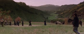 Movie still from “The Last Samurai” (2003), directed by Edward Zwick – Two people are walking through a grassy field; Extreme Wide shot, High angle